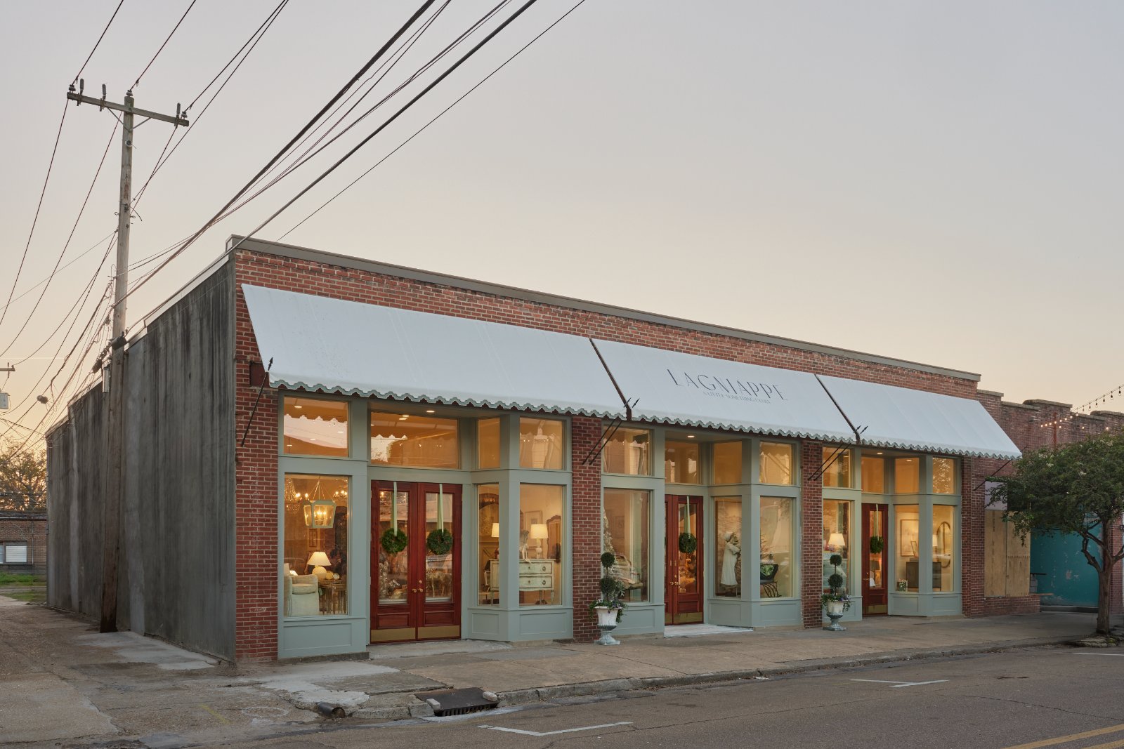 The rehabilitated storefronts on East 3rd Street in Leland, Mississippi, seen from the corner at dusk
